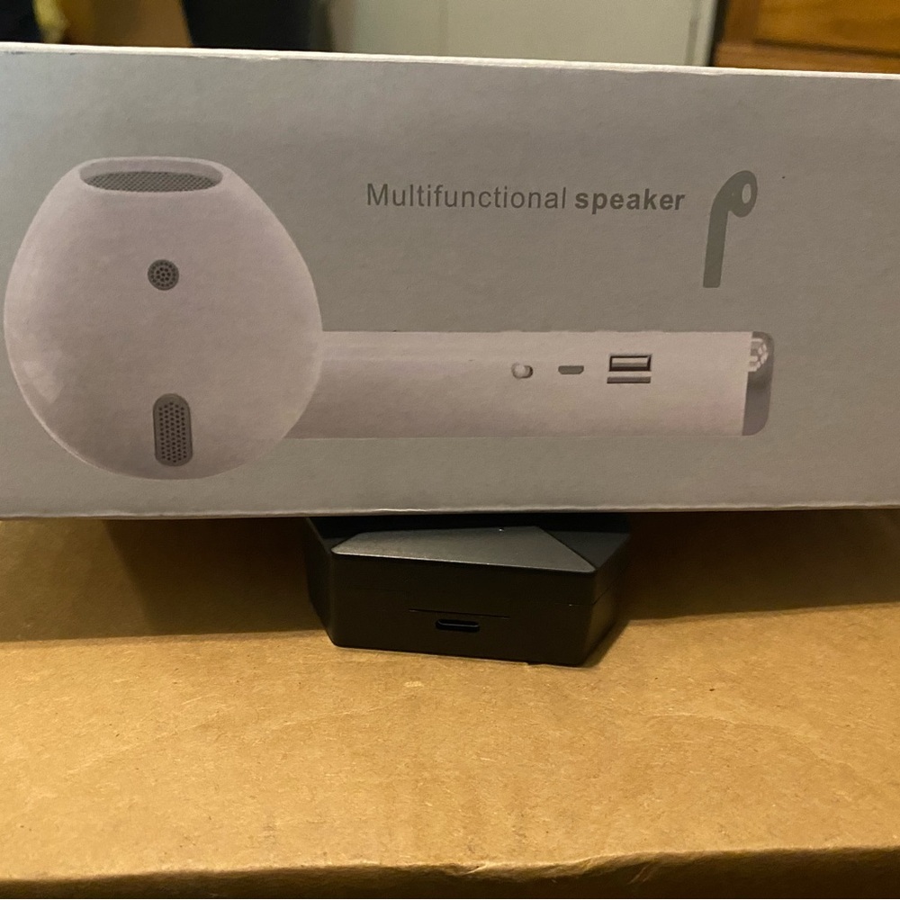 White Portable Bluetooth Speaker with Sleek Design and Multifunctionality